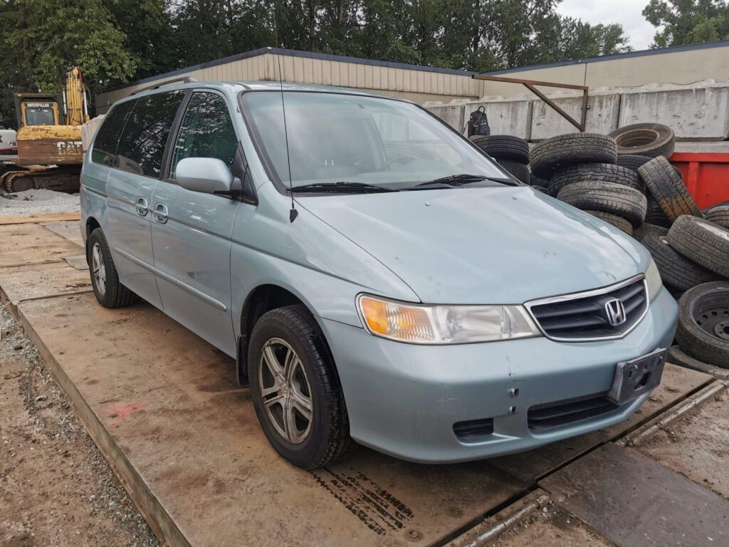 Buy used vans service featuring a clean Honda Odyssey minivan ready for a new owner