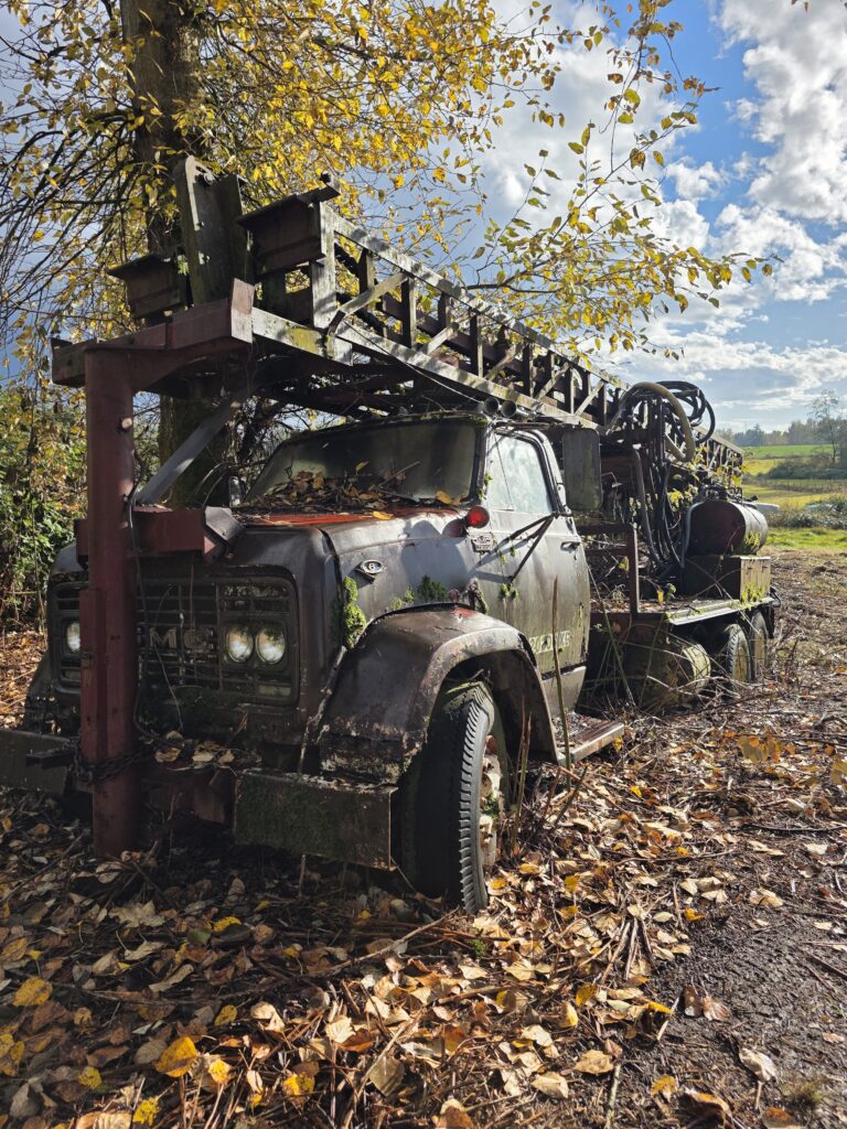 We offer cash for old machines like this weathered drilling rig truck in Burnaby, BC