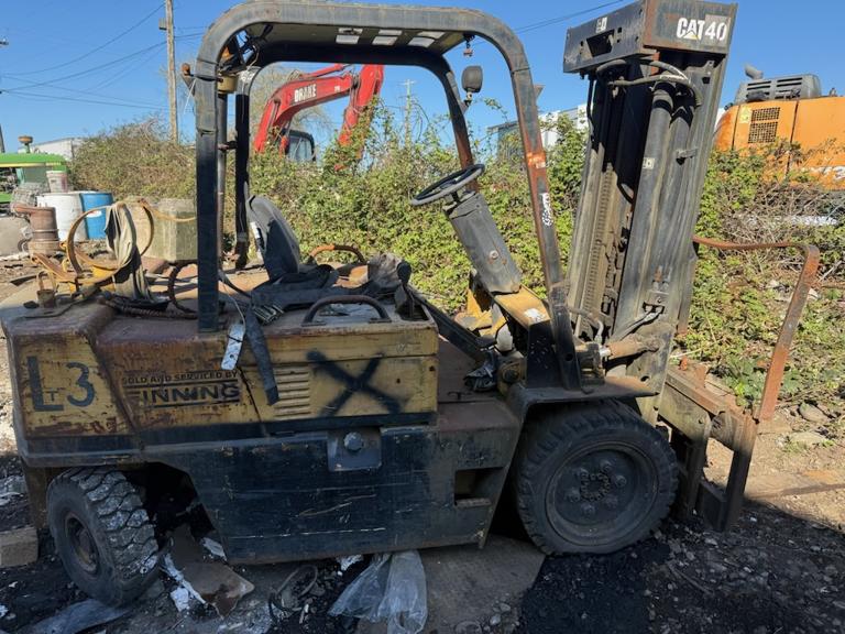 Scrap forklift removal service in Burnaby, BC - this worn CAT forklift ready for pickup